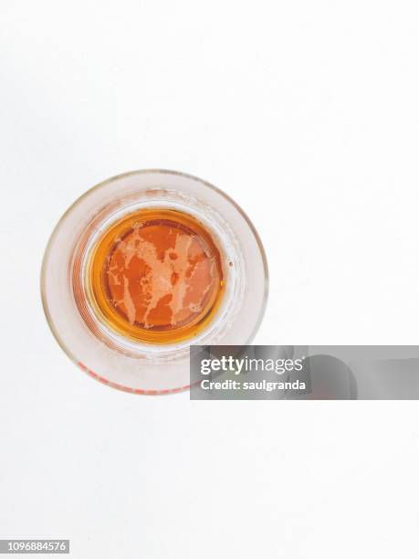 view from above of a glass full of beer - empty beer glass stock pictures, royalty-free photos & images