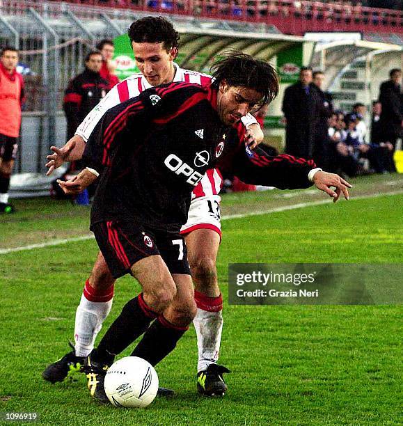 Gianluca Comotto of Vicenza and Francesco Coco of AC Milan during the SERIE A 18th Round League match between Vicenza and AC Milan, played at the...