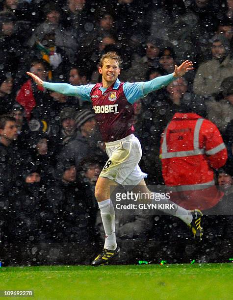 West Ham's US defender Jonathan Spector celebrates scoring the second goal during their quarter final League Cup football match against Manchester...