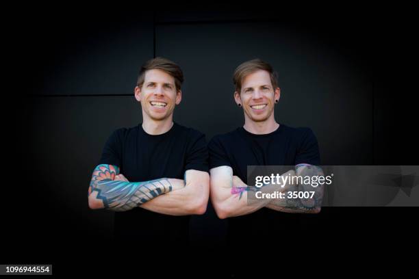 lol - twin brothers laughing out loud - identical twin stock pictures, royalty-free photos & images