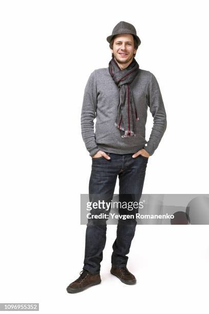 full length portrait of handsome young man in a sweater isolated on white background - men bulge imagens e fotografias de stock
