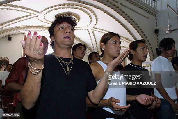 With a religious mass the "Muxes" celebrate their day in the town of Juchitan Oaxaca, 16 November 2002. This is the only town where homosexuality is...