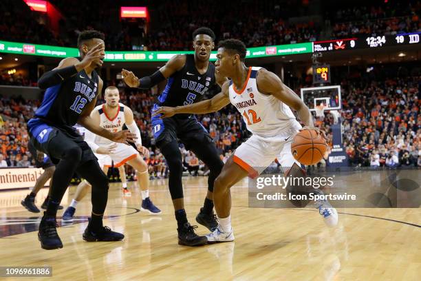 Virginia Cavaliers Guard De'Andre Hunter tries to drive to the lane defended by Duke Blue Devils Forward Javin DeLaurier Duke Blue Devils Forward RJ...