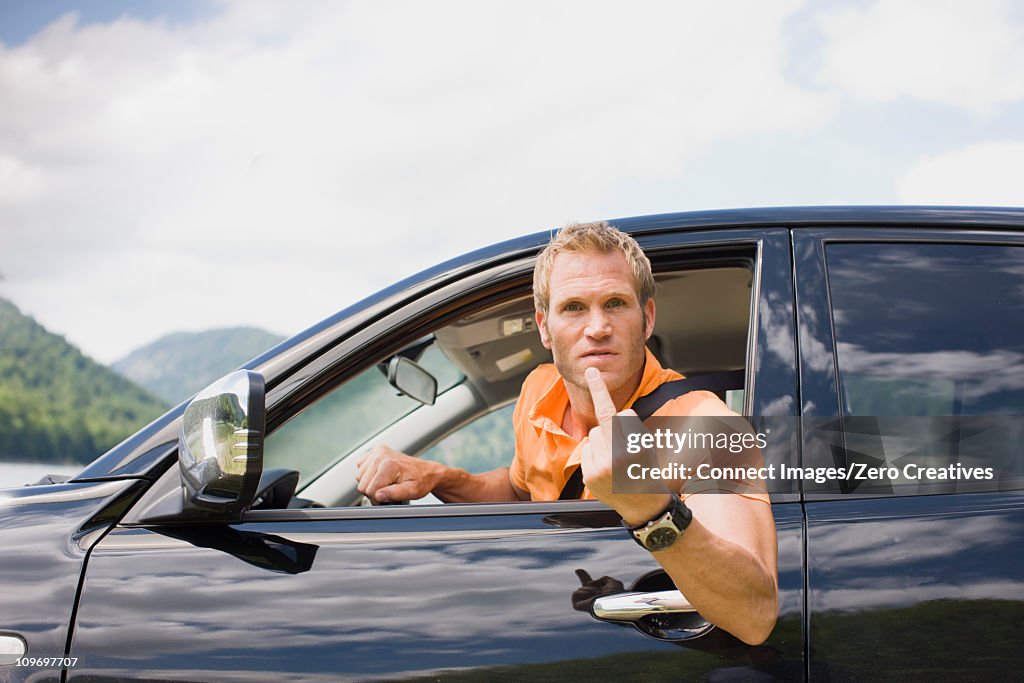Angry man in a black car