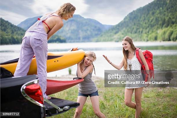 girls on a boat trip - teenagers boat stock-fotos und bilder