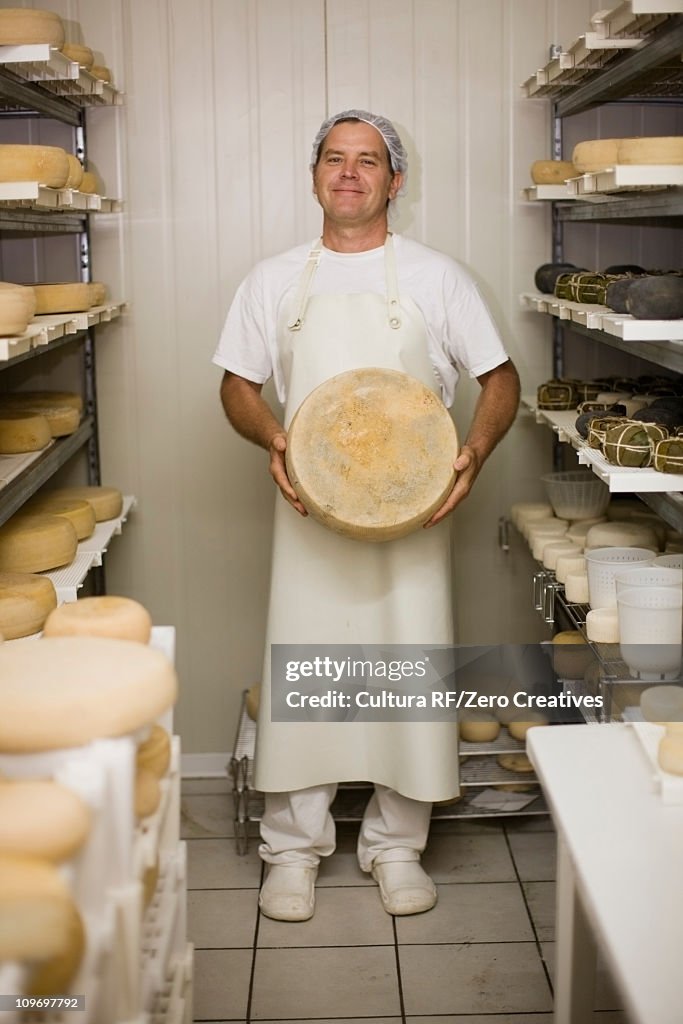 Worker at a cheese dairy