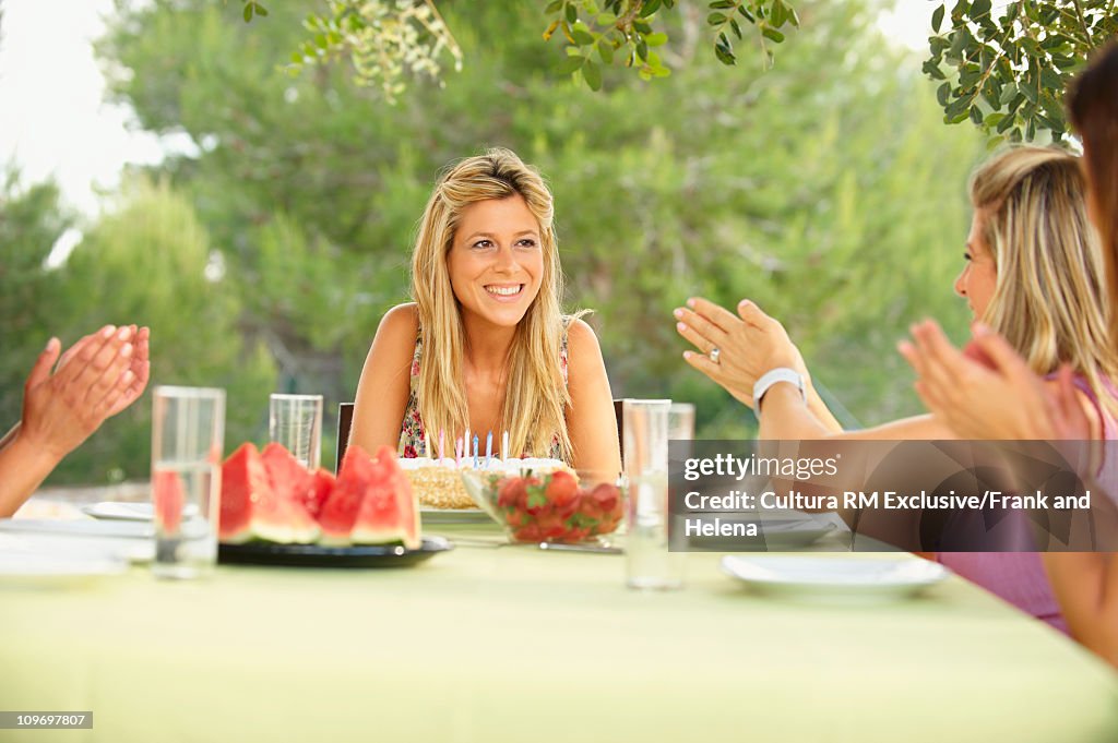 Young woman having birthday celebrations