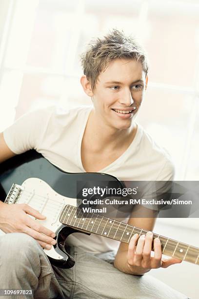 man playing guitar - stourbridge stock pictures, royalty-free photos & images