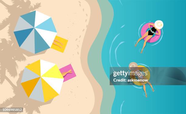 stockillustraties, clipart, cartoons en iconen met vrouwen zwemmen op de opblaasbare ring - zand