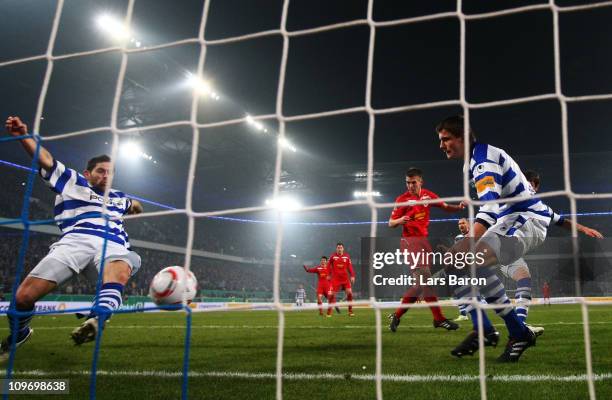 Olivier Veigneau of Duisburg stopps a header of Uwe Huenemeier of Cottbus during the DFB Cup semi final match between MSV Duisburg and Energie...