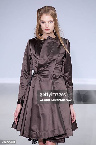 Model walks the runway during the Moon Young Hee Ready to Wear Autumn/Winter 2011/2012 show during Paris Fashion Week at Espace Commines on March 1,...