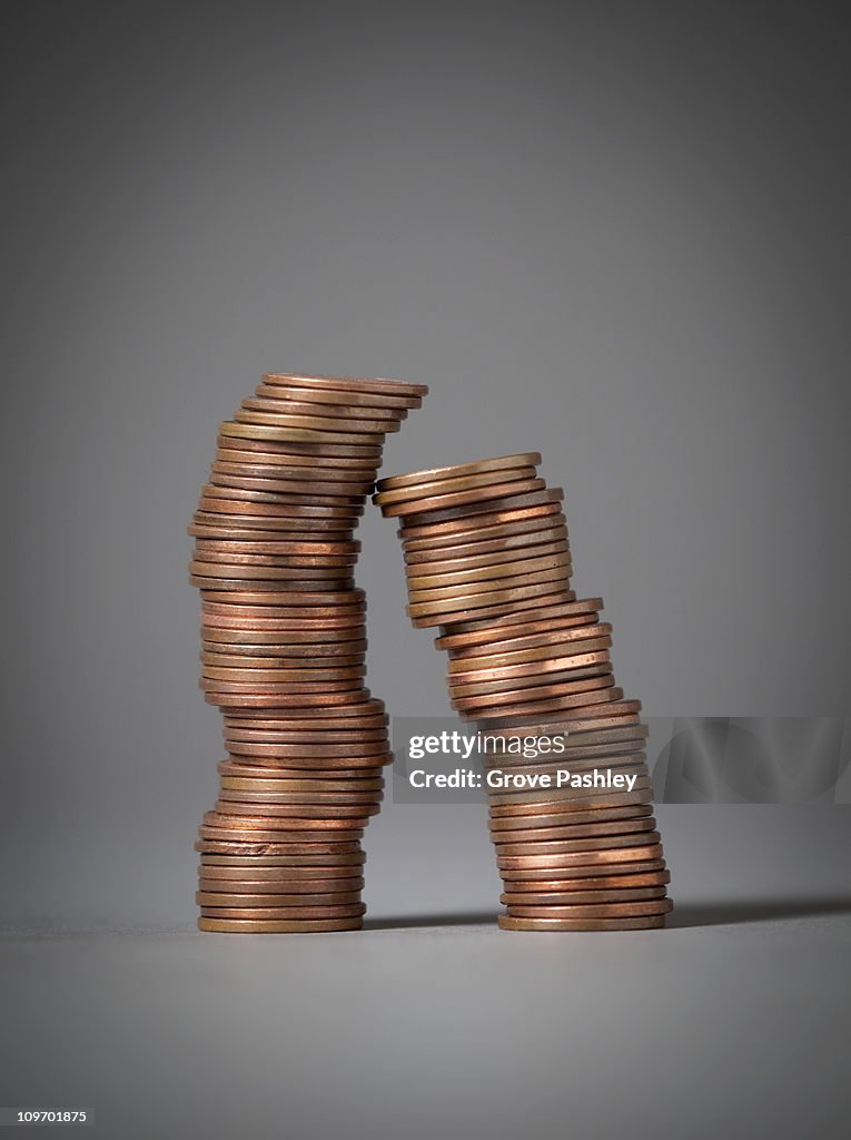 Two Leaning Stack of  Pennies