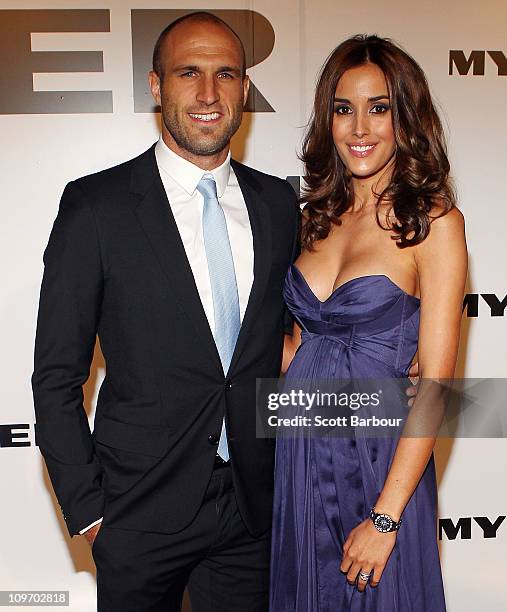 Model Rebecca Judd and AFL player Chris Judd arrive at the Myer Autumn/Winter Season Launch 2011 at The Royal Exhibition Building on March 1, 2011 in...