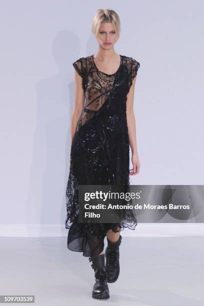 Model walks the runway during the Moon Young Hee Ready to Wear Autumn/Winter 2011/2012 show during Paris Fashion Week at Espace Commines on March 1,...