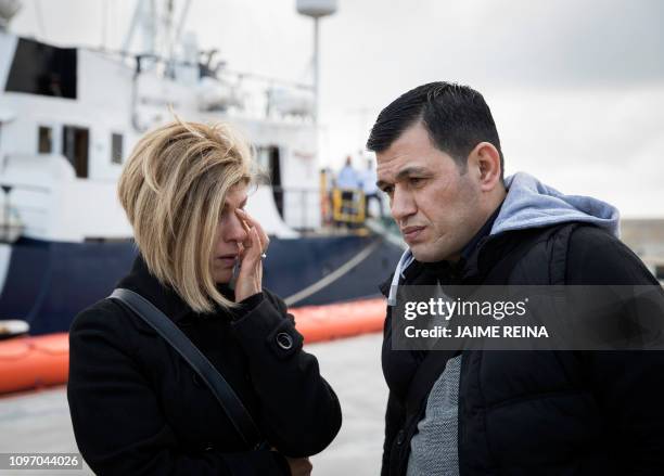 Abdullah Kurdi and his siter Tima react in front of a Sea-Eye rescue ship named after his son and her nephew Alan Kurdi during its inauguration in...