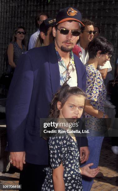 Actor Charlie Sheen and daughter attend the world premiere of "The Mighty Ducks" on September 20, 1992 at the Avco Center Theater in Westwood,...