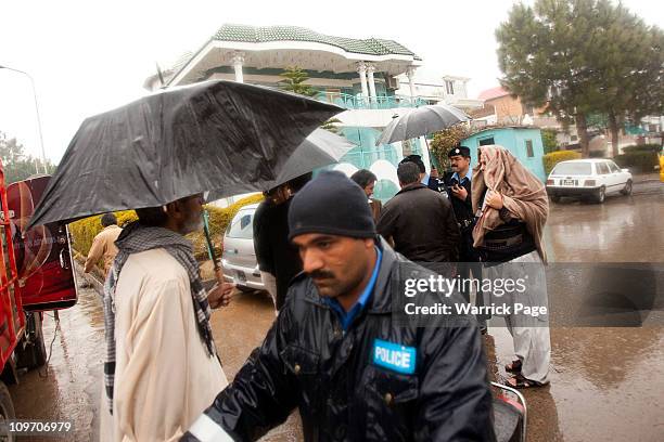 Police officers secure the site of Pakistan Minority Minister, Shahbaz Bhatti's, assassination near his mother's home on March 2, 2011 in Islamabad,...