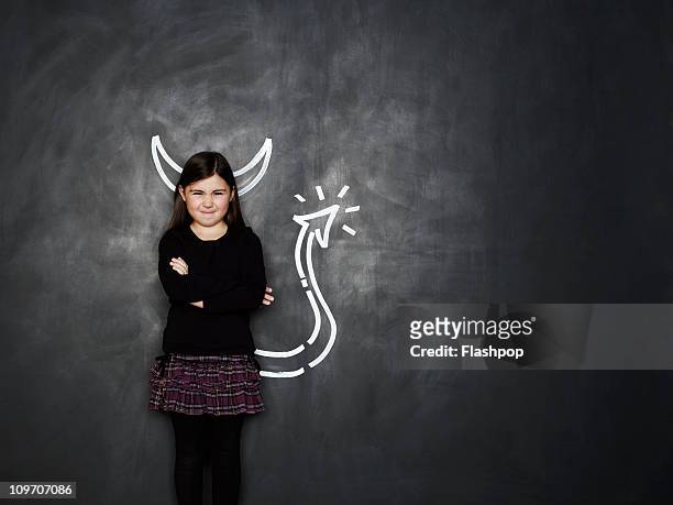 girl with devil horns and tail - teufel stock-fotos und bilder