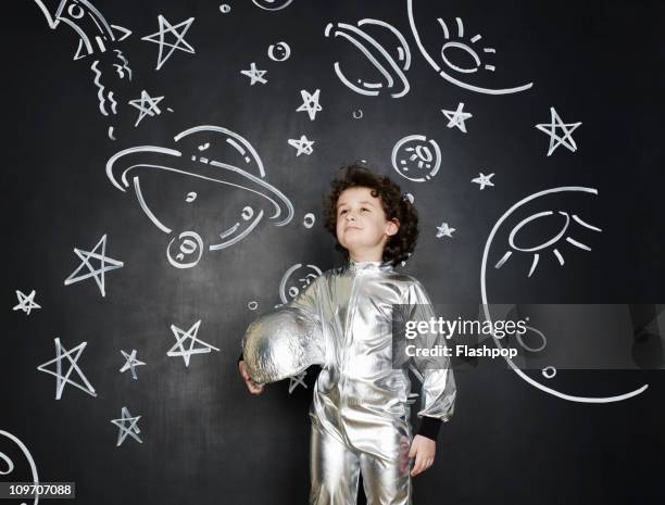 boy dressed as an astronaut - silver dreams photography stock pictures, royalty-free photos & images