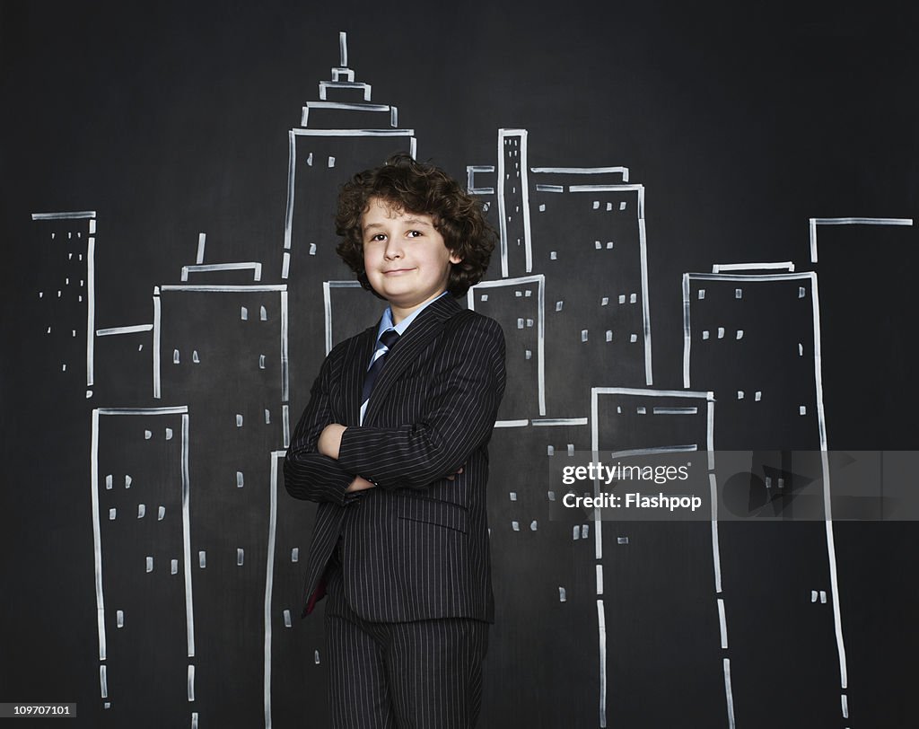 Boy as a businessman with cityscape background