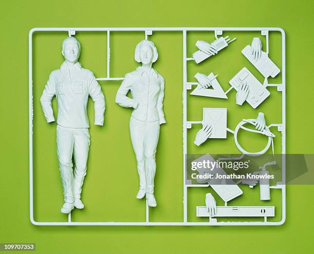 plastic template of a model employee - computerteil stock-fotos und bilder