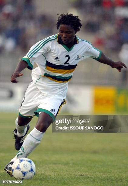 South African defender Mbulelo Old John controls the ball 24 January 2002 in Segou, during the soccer match between South Africa and Ghana for the...