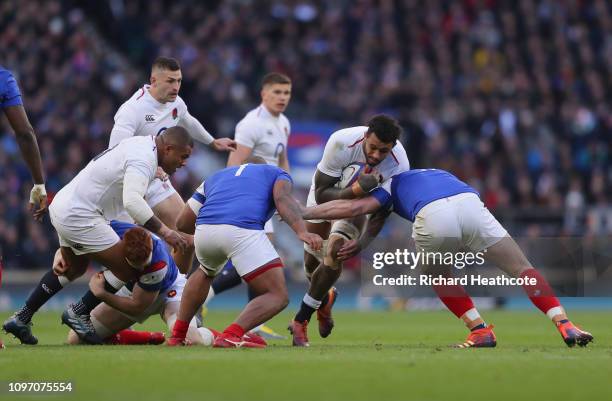 Courtney Lawes tackled by Sebastien Vahaamahina and Louis Picamoles of France during the Guinness Six Nations match between England and France at...