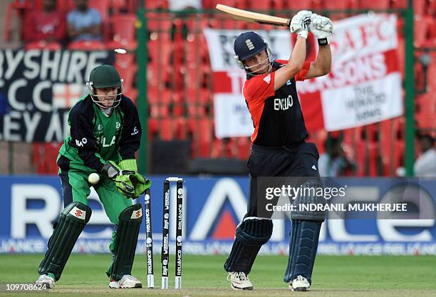 Ireland cricketer Niall O'Brien looks on as England cricketer Jonathan Trott is bowled out by unseen Irish cricketer John Mooney during The ICC...