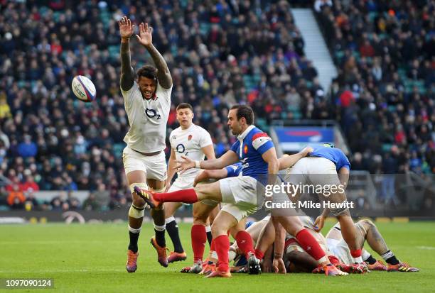 Courtney Lawes of England attempts to block a kick by Morgan Parra of France during the Guinness Six Nations match between England and France at...