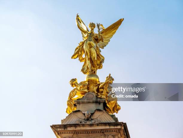 golden angel - monument station london stock pictures, royalty-free photos & images