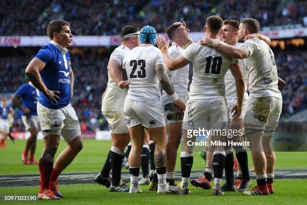 Owen Farrell of England celebrates scoring his sides fifth try with teammates during the Guinness Six Nations match between England and France at...