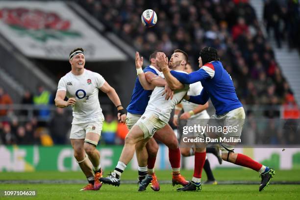 Luke Cowan-Dickie of England tackled by Louis Picamoles and Arthur Iturria of France during the Guinness Six Nations match between England and France...