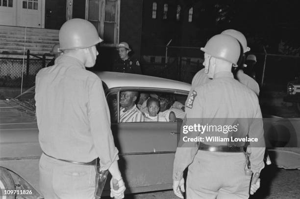 Members of the New York State Police on duty during a race riot in Rochester, New York State, late July 1964.