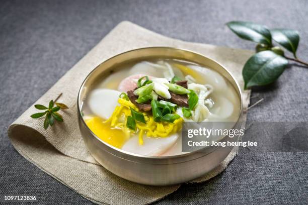 korean new year's food, rice cake soup(tteok-guk) - rice cakes stock pictures, royalty-free photos & images