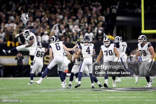 Johnny Hekker and Greg Zuerlein of the Los Angeles Rams celebrate after kicking the game winning field goal in overtime against the New Orleans...