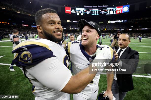 Aaron Donald and Greg Zuerlein of the Los Angeles Rams celebrate after defeating the New Orleans Saints in the NFC Championship game at the...