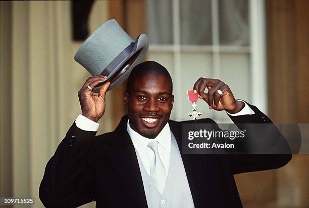 Martin Offiah Mbe, London Bronco's and England International Rugby Player, Pictured outside Buckingham Palace after receiving his MBE.