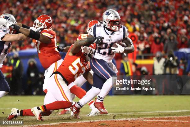 Sony Michel of the New England Patriots rushes for a 1-yard touchdown in the first quarter as Anthony Hitchens of the Kansas City Chiefs attempts to...