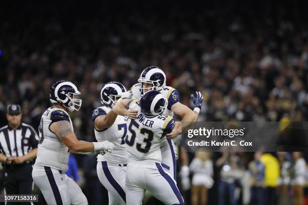 Johnny Hekker and Greg Zuerlein of the Los Angeles Rams celebrate after kicking the game winning field goal in overtime against the New Orleans...