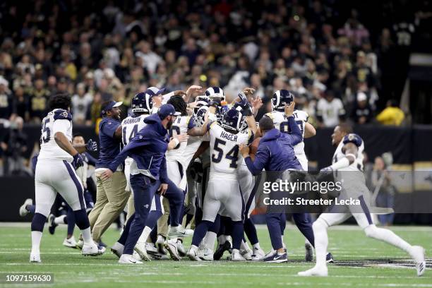 Johnny Hekker and Greg Zuerlein of the Los Angeles Rams celebrate after kicking the game winning field goal in overtime against the New Orleans...