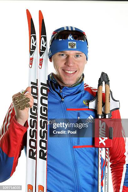 Alexander Panzhinskiy of Russia poses with the bronze medal won in the Men's Cross Country Team Sprint race during the FIS Nordic World Ski...