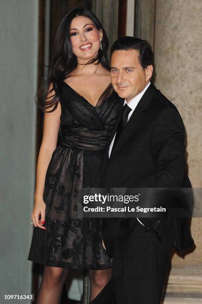 French Minister of Immigration and National Identity Eric Besson and wife Yasmine are seen at Elysee Palace as they arrive to attend a state dinner...