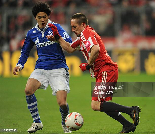 Bayern Munich's French midfielder Franck Ribery vies for the ball with Schalke's Japanese defender Atsuto Uchida during the German Cup semi-final...