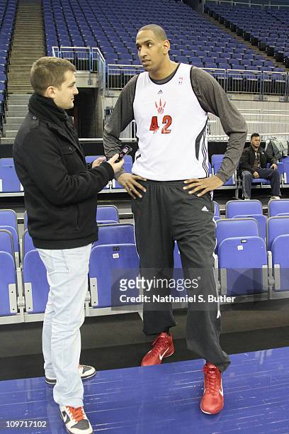 Alexis Ajinca of the Toronto Raptors talks to media during practice at the O2 Arena on March 2, 2011 in London, England. NOTE TO USER: User expressly...