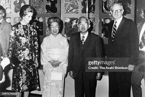 Emperor Hirohito and Empress Nagako pose for photographs with John D. Rockefeller III and his wife Blanchette at the Japan House on October 6, 1975...