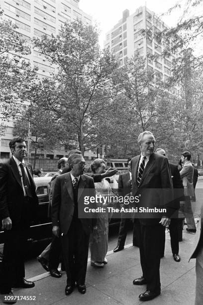 Emperor Hirohito is welcomed by John D. Rockefeller III on arrival at the Japan House on October 6, 1975 in New York City.