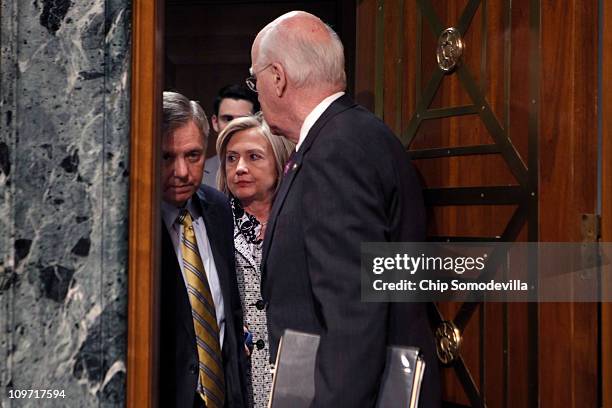 Secretary of State Hillary Clinton talks briefly with Senate Appropriations Subcommittee on State, Foreign Operations, and Related Programs ranking...