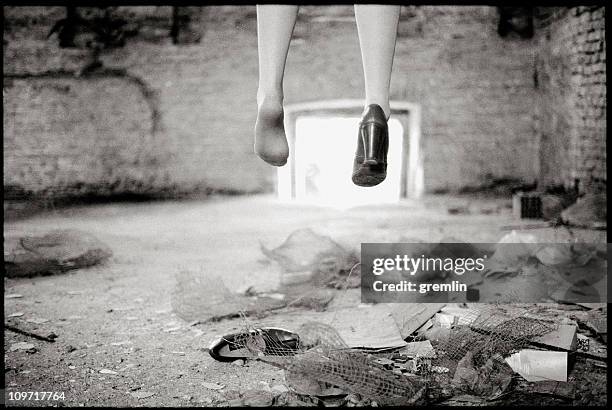 woman's feet missing one shoe in abandoned building - hanging death photos stock pictures, royalty-free photos & images