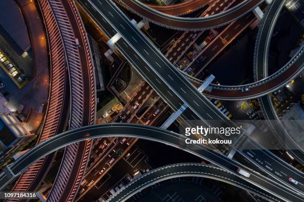 night photograph of complicated intersecting highway. - aerial view stock pictures, royalty-free photos & images