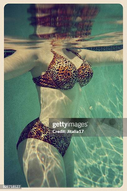 woman in cheetah print bikini - vintage postcard - women in skimpy bathing suits stock pictures, royalty-free photos & images